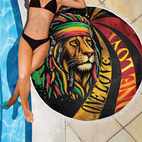 Round beach blanket featuring lion face graphic with white fringed border