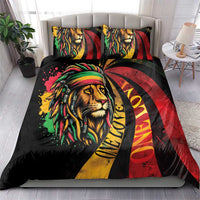 Bed duvet and two matching pillowcases featuring lion portrait with red, yellow, green bands