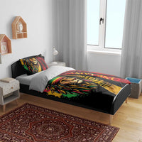 Bedroom bed with duvet featuring lion face graphic in red, green, and yellow reggae style