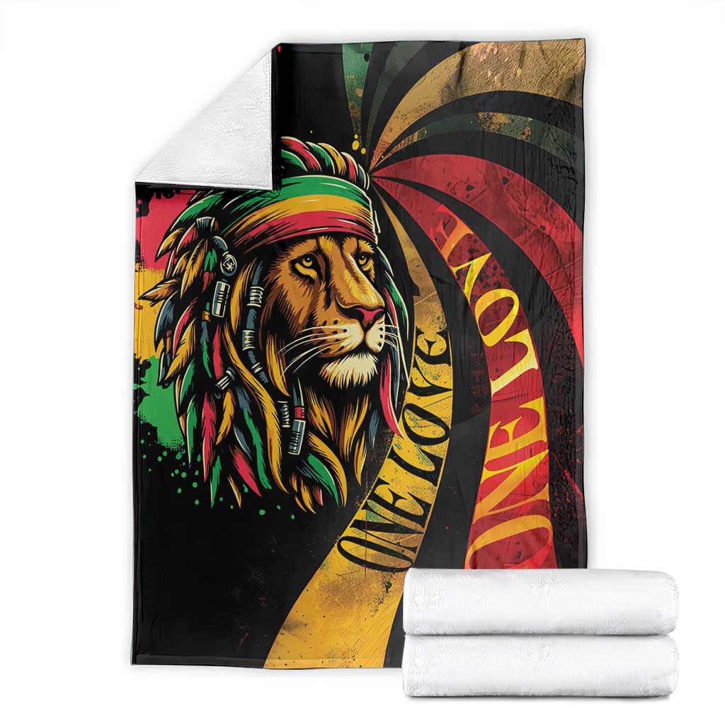 Folded black lion graphic blanket with reggae tricolor rays in red, yellow, and green