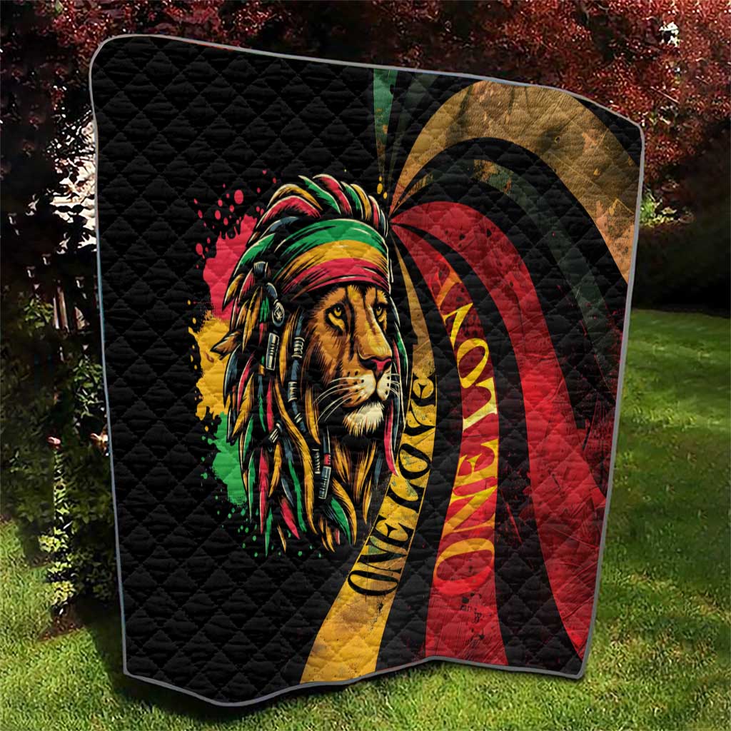 Quilted black blanket with lion portrait, rainbow headwrap, and red-yellow swirl pattern.