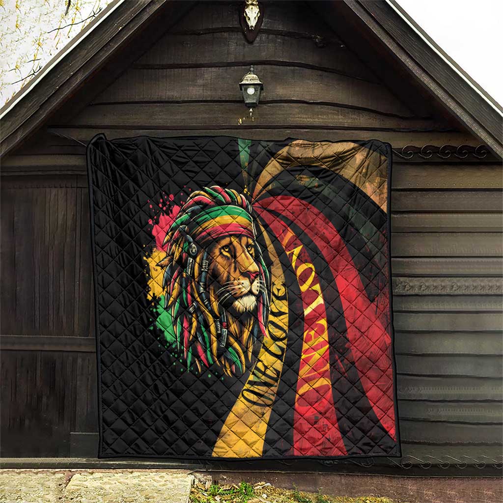Black quilted blanket with large lion portrait, rainbow headwrap, and red-yellow swirl.