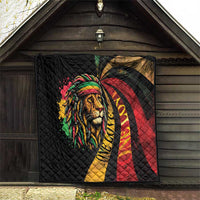 Black quilted blanket with large lion portrait, rainbow headwrap, and red-yellow swirl.