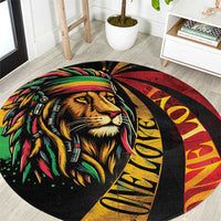 Round carpet with black lion face, Rastafarian colors, gold 'One Love' lettering