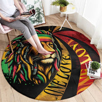 Round carpet with lion face graphic and 'One Love' text in red, yellow, green