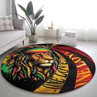 Round lion graphic carpet in red, yellow, and green with 'One Love' lettering
