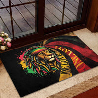 Rectangular rubber doormat with lion face artwork and bold red yellow reggae arcs