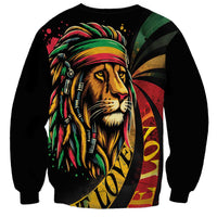 Unisex black crewneck sweatshirt with lion head and jamaica-style stripes graphic, long sleeves.