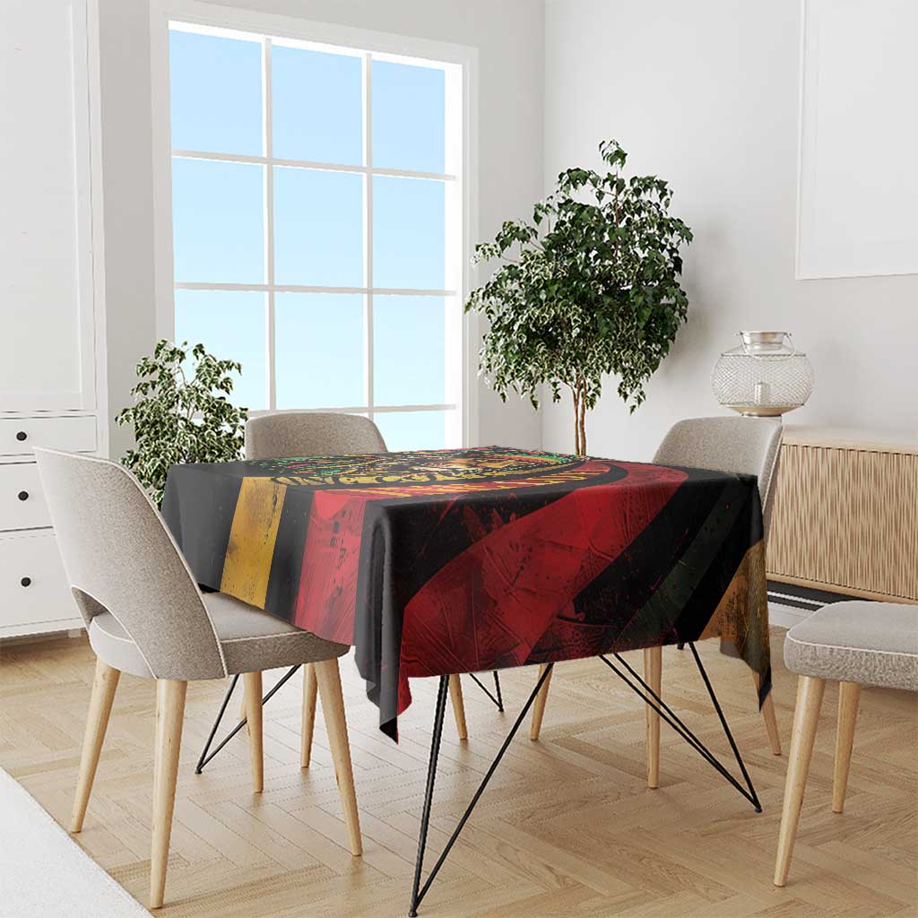 Rectangular tablecloth with lion graphic, red and yellow panels, and black border
