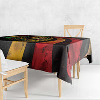 Tablecloth with corner drape and lion design in red, black, and yellow blocks