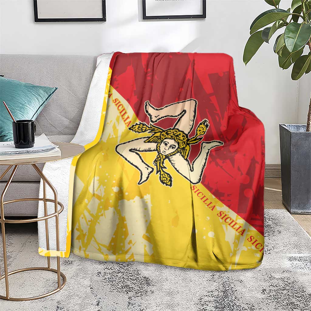Red and yellow Sicilian flag throw blanket with angel emblem on armchair