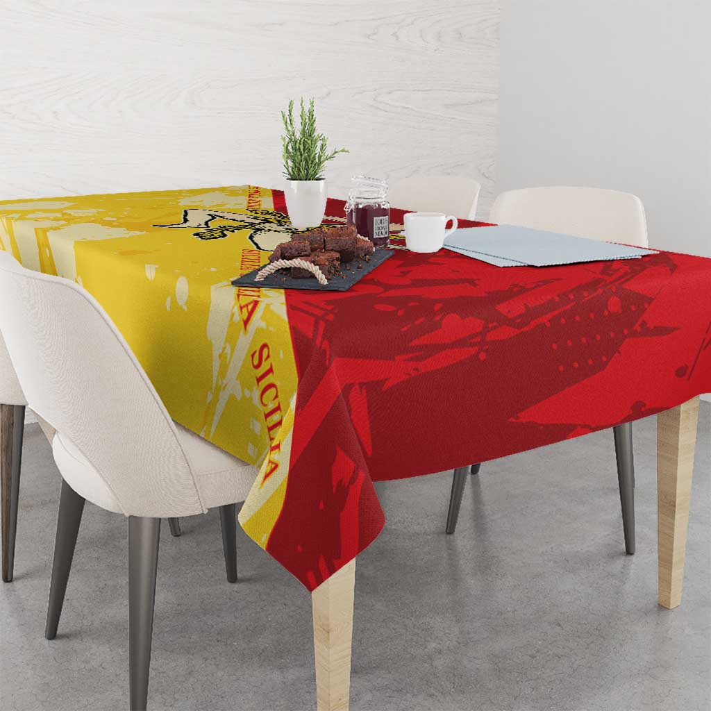 Sicily region tablecloth in gold and red, draped over dining table edge