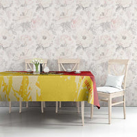 Sicily region tablecloth in gold and red over dining table with chairs