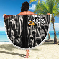 Round beach blanket with “Make History Her” text and black-and-white woman photo, fringe