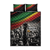 Black quilt bed set, front view: diagonal red, green, yellow stripe panels, Make History logo