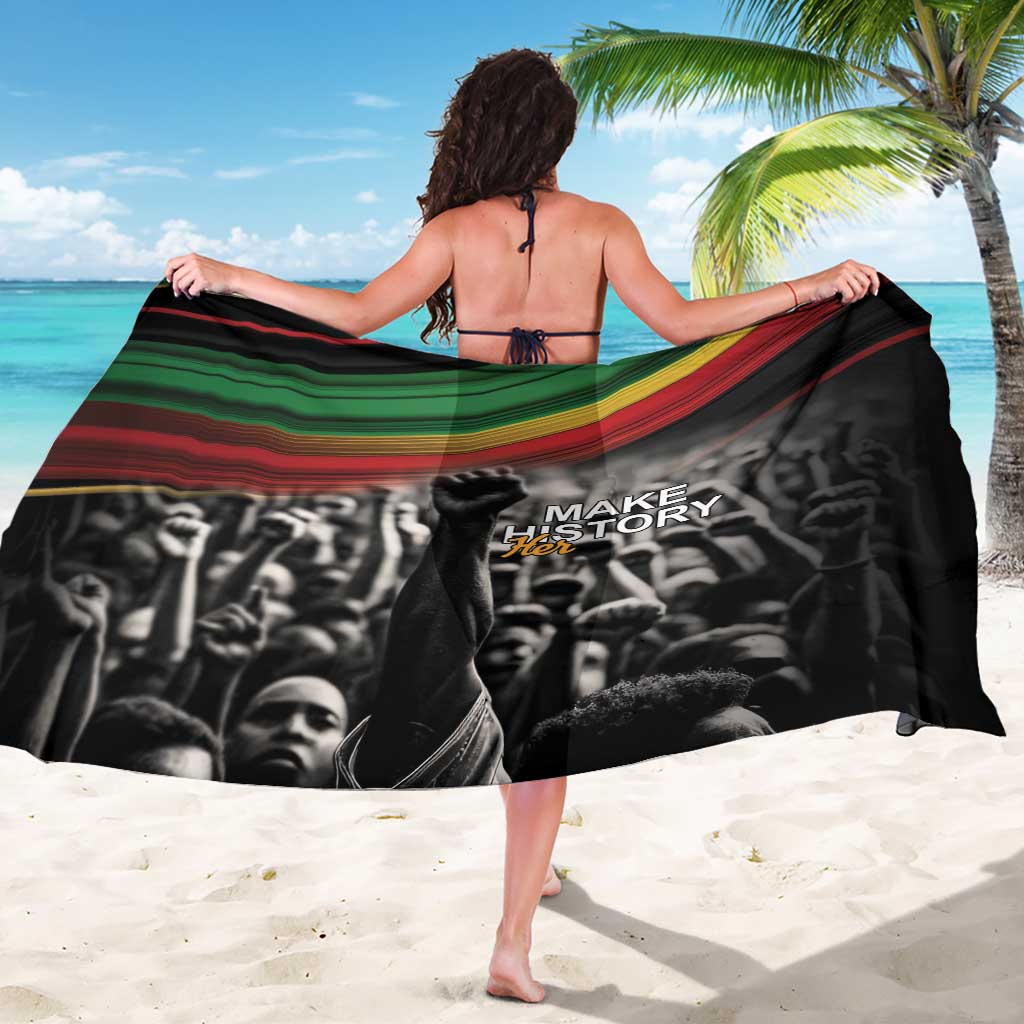 Black “Make History Her” sarong with diagonal red-green-gold stripe band