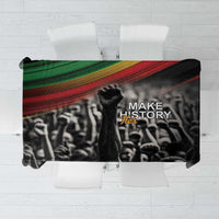 Black tablecloth with multicolor stripe and “Make History Her” text and figures print