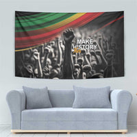 Black rectangular tapestry with multicolor stripe top, raised fist and crowd graphic
