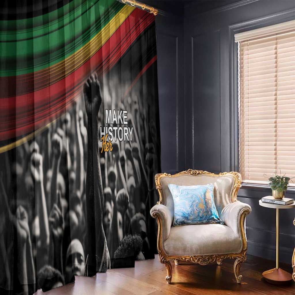 Black window curtain with “Make History Her” and African flag stripe pattern, close view