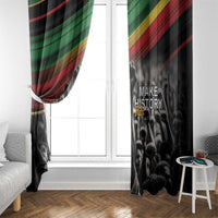 Black window curtain panel with “Make History Her” print and diagonal flag stripes, side view