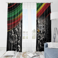 Black window curtain pair with “Make History Her” text; diagonal stripe accents and crowd print
