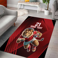 Red rectangular area rug with lion mascot, “21” and “YOUR TEHT” text