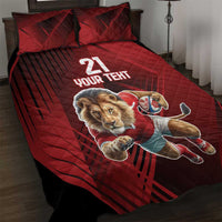 Red quilt bed set with lion mascot graphic and 'YOUR TEXT' on quilt and pillows