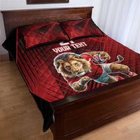 Red quilt bed set with lion mascot graphic on quilt and pillow, red check pattern