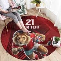 Red circular lion mascot sports rug with “21 YOUR TERT” lettering and jersey graphic