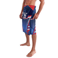 Men's blue rugby board shorts with bold red-white graphics and angled stripe panels