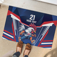 Blue rubber doormat showing rooster artwork and “21 YOUR TEXT” with striped flag design