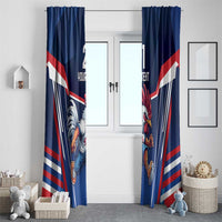Blue curtain panels with rooster artwork and patriotic flag design, hanging by a doorway.