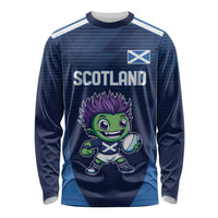 Blue long-sleeve rugby shirt with SCOTLAND text, mascot graphic, and front logo panel.