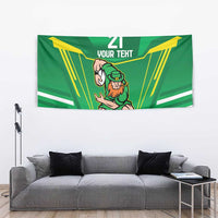 Green rugby tapestry with leprechaun warrior mascot, yellow rays, '21' and 'Your Text' design.