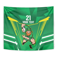 Close-up green rugby tapestry showing leprechaun warrior mascot, '21' and 'Your Text' text.