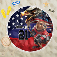 Round beach blanket with fringe edge, blue red eagle-and-dog hockey graphic and 21