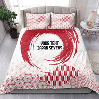 Red and white bedding set with duvet cover, two pillowcases, geometric grid, waves, and emblem