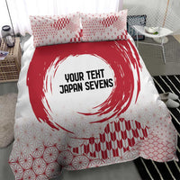 Red and white duvet cover with bold circle emblem, geometric lines, and wave pattern