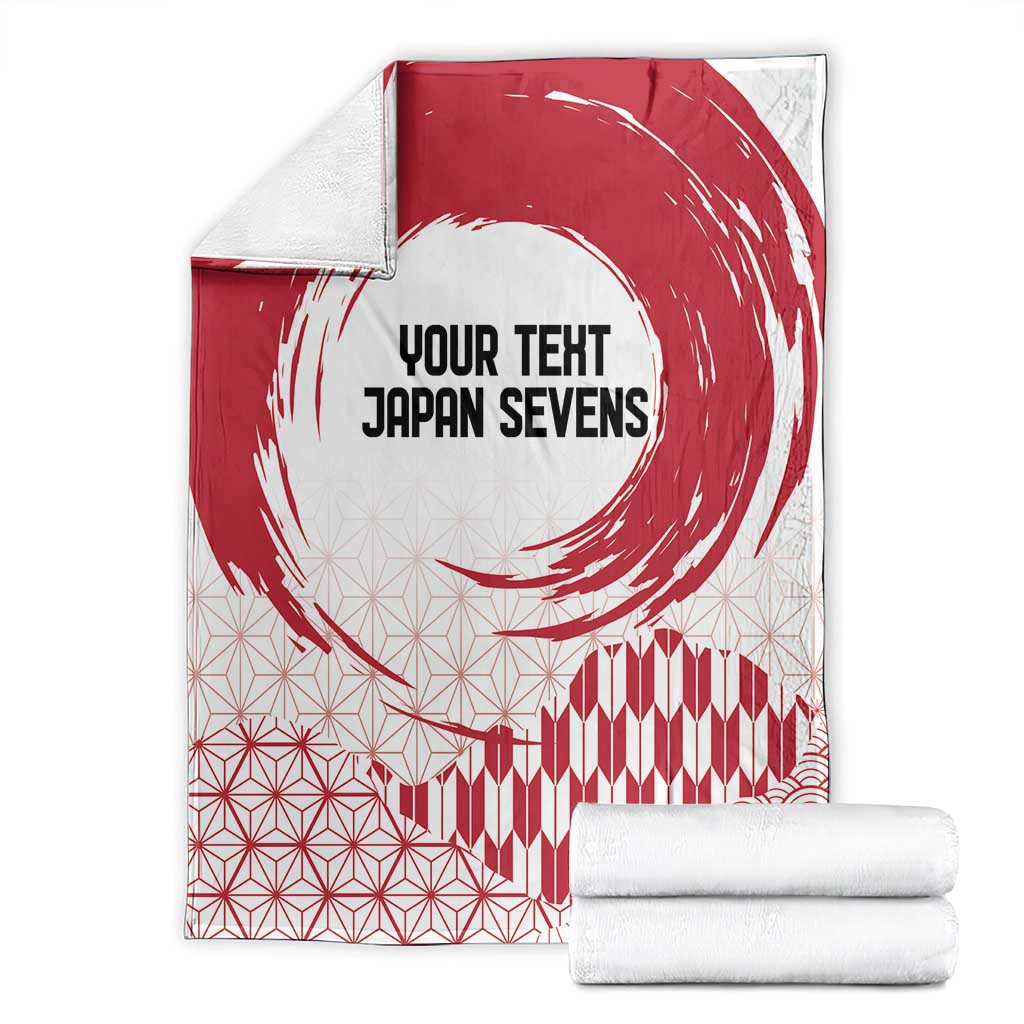 Red and white blanket folded with “YOUR TEXT JAPAN SEVENS” and rising sun swirl