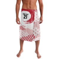 White and red patterned lavalava sarong with red sun and geometric motifs