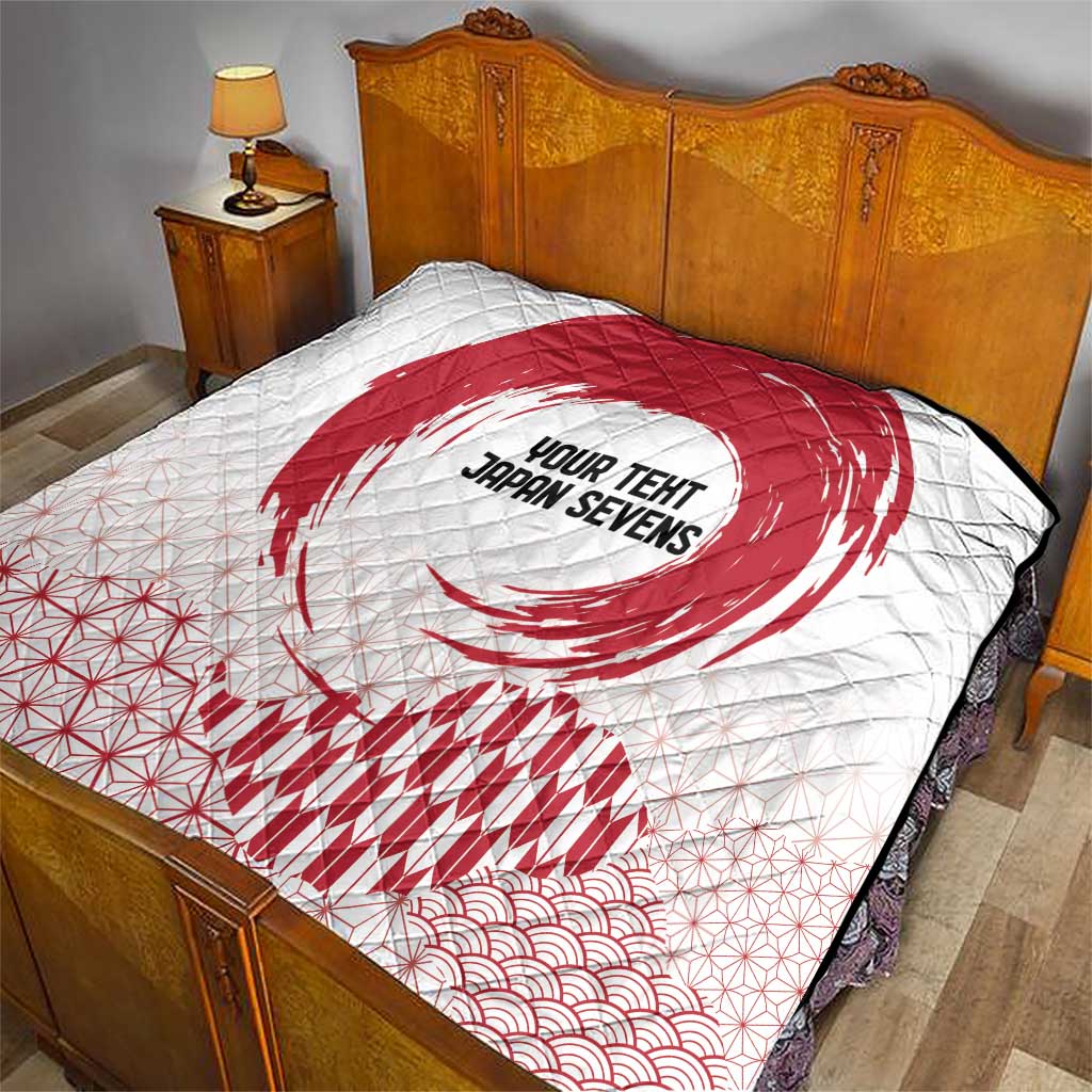 White quilt on a bed with red rising sun graphic, 'YOUR TENT JAPAN SEVENS' text, and waves.