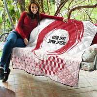 White quilt laid out on patio with red rising sun, 'YOUR TENT JAPAN SEVENS' text, and waves.