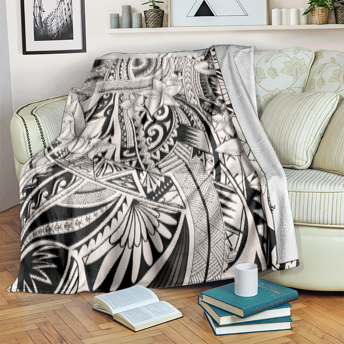 Tribal polynesian print throw blanket draped on couch, black-and-white geometric flowers