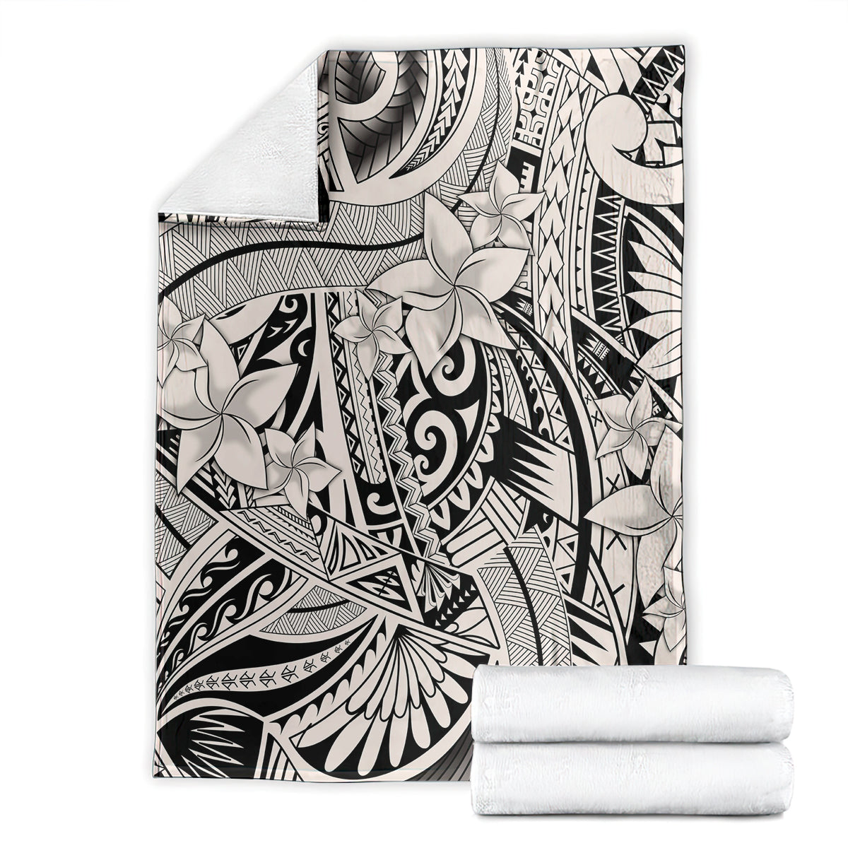 Tribal polynesian print blanket with rolled white towels, black-and-white floral geometric