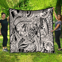Black-and-white tribal quilt blanket with ornate floral motifs and patterned swirls