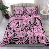 Pink and black tribal flower bedding set shown on a bed with matching pillowcases.