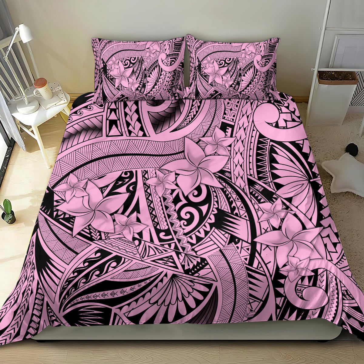 Pink and black tribal floral bedding set with matching pillows and bold geometric stripes.