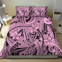 Pink and black tribal floral bedding set with matching pillows and bold geometric stripes.