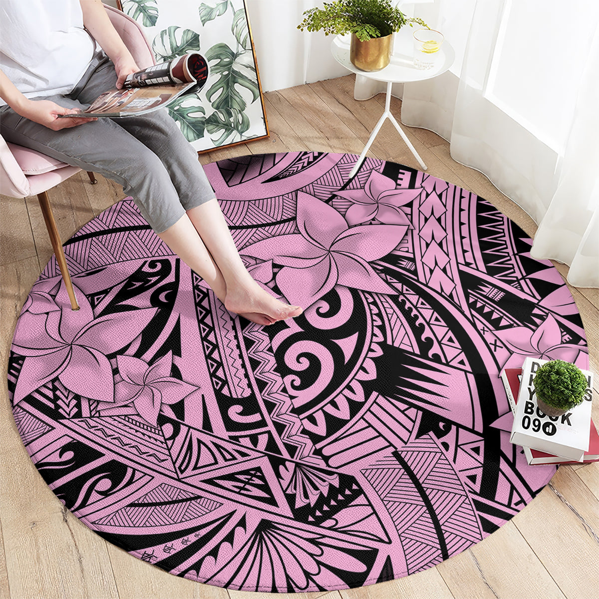 Round pink and purple tribal rug with large floral medallion and black geometric lines