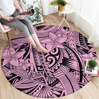 Round pink and purple tribal rug with large floral medallion and black geometric lines
